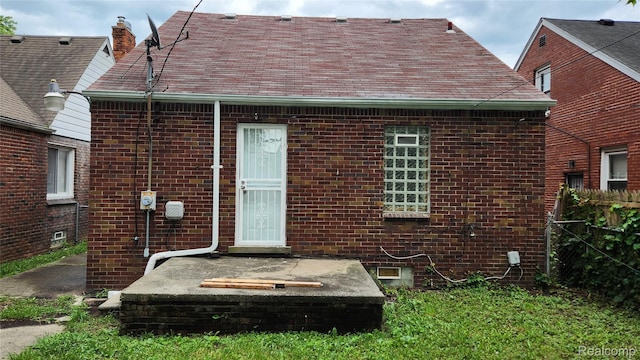 10947 Roxbury St, Detroit, MI 48224 - back of property featuring brick siding and a chimney