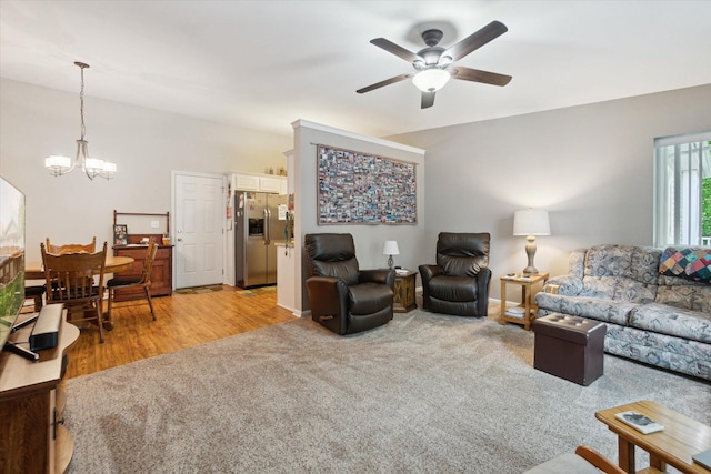 9422 Timber Ridge Dr, Grand Blanc, MI 48439 - living room featuring a chandelier, ceiling fan, and light wood-style floors