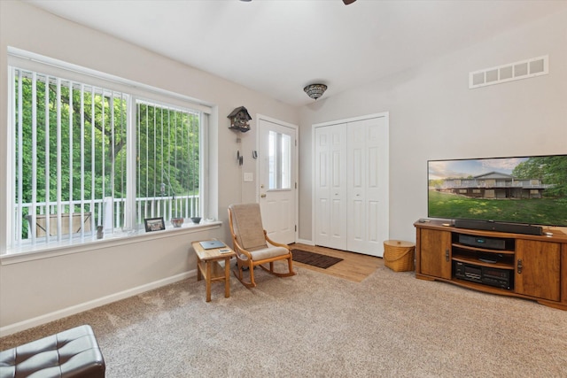 9422 Timber Ridge Dr, Grand Blanc, MI 48439 - living area with carpet floors and a ceiling fan