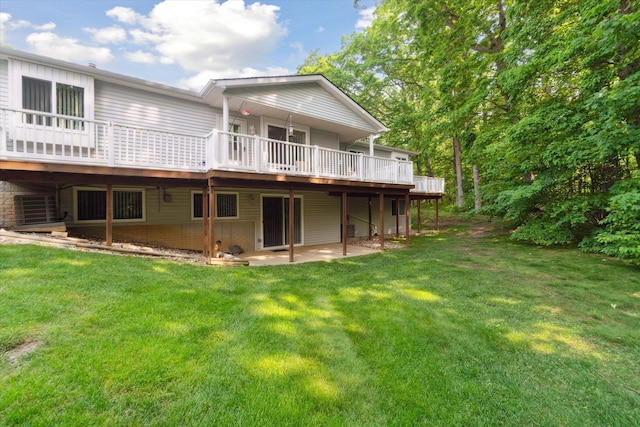 9422 Timber Ridge Dr, Grand Blanc, MI 48439 - rear view of house featuring a lawn, a patio area, and a wooden deck