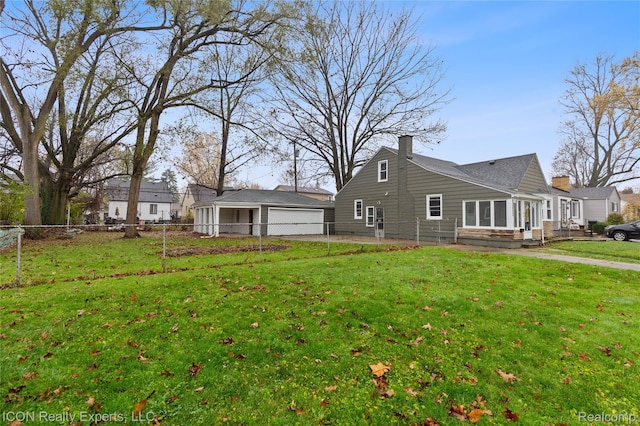 20628 Alger St, Saint Clair Shores, MI 48080 - view of side of property with a chimney, a garage, and an outbuilding