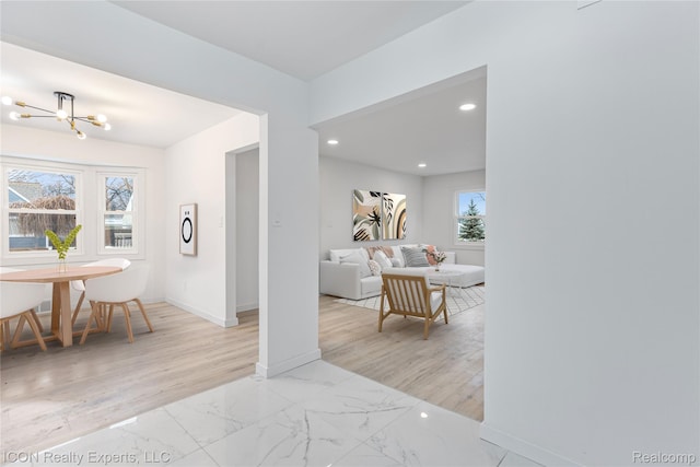 20628 Alger St, Saint Clair Shores, MI 48080 - hall with marble look tile flooring, a chandelier, and recessed lighting