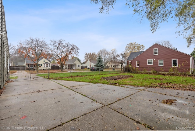 20628 Alger St, Saint Clair Shores, MI 48080 - view of yard with a gate, concrete driveway, and a residential view