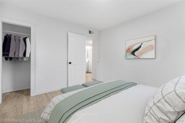 20628 Alger St, Saint Clair Shores, MI 48080 - bedroom with light wood-type flooring, a walk in closet, and a closet