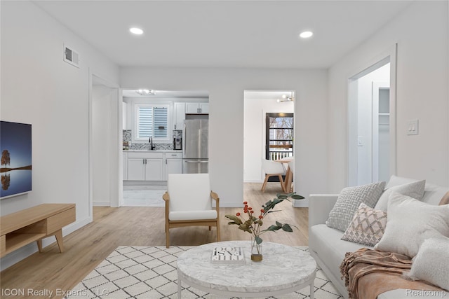 20628 Alger St, Saint Clair Shores, MI 48080 - living room featuring plenty of natural light, light wood-style floors, and recessed lighting