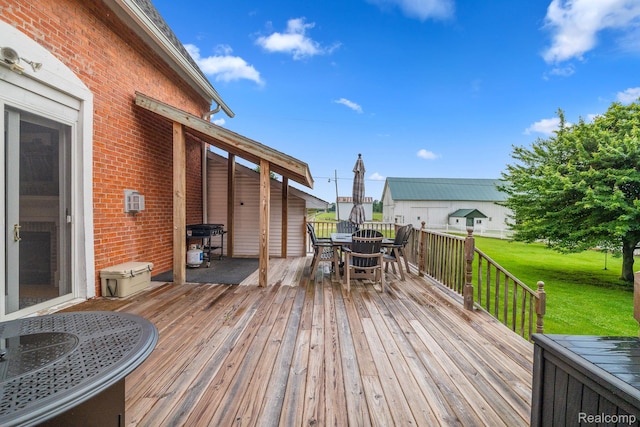 1666 Capac Rd, Berlin, MI 48002 - wooden deck featuring outdoor dining area, a yard, and a grill