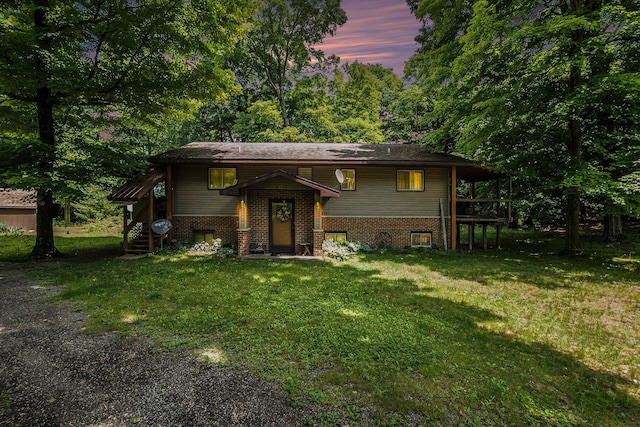 4424 Teal Ln, Newaygo, MI 49337 - split foyer home featuring a front lawn and brick siding