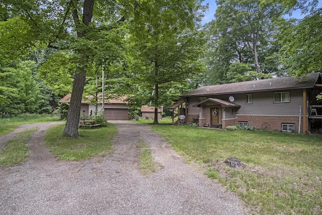 4424 Teal Ln, Newaygo, MI 49337 - view of front facade featuring an outbuilding, a front yard, and a garage
