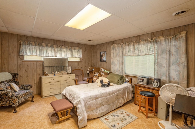 4424 Teal Ln, Newaygo, MI 49337 - bedroom with wooden walls, a drop ceiling, and carpet