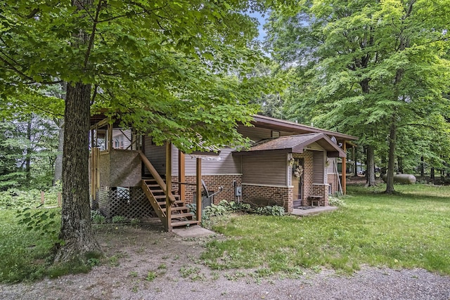 4424 Teal Ln, Newaygo, MI 49337 - view of front of house featuring stairway and brick siding