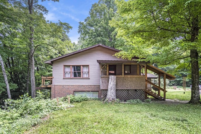 4424 Teal Ln, Newaygo, MI 49337 - view of front facade featuring stairs and a front yard