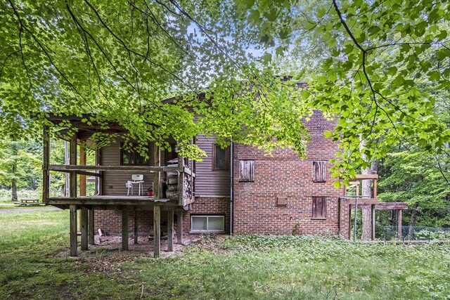 4424 Teal Ln, Newaygo, MI 49337 - rear view of house featuring brick siding and a deck