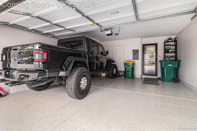 475 Jenny Way, Brighton, MI 48116 - garage with electric panel and a garage door opener
