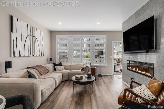 475 Jenny Way, Brighton, MI 48116 - living room featuring a fireplace, wood finished floors, and recessed lighting