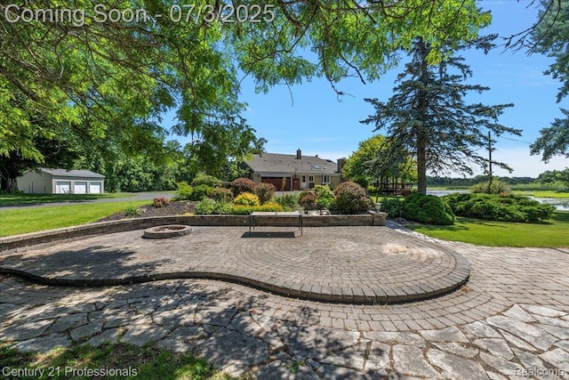 291 N Baldwin Rd, Clarkston, MI 48348 - view of property's community with a yard, a fire pit, a water view, and a patio