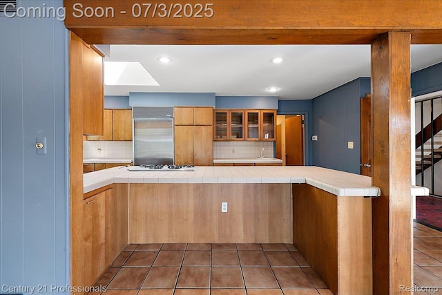 291 N Baldwin Rd, Clarkston, MI 48348 - kitchen with stainless steel built in fridge, tile counters, decorative backsplash, and recessed lighting