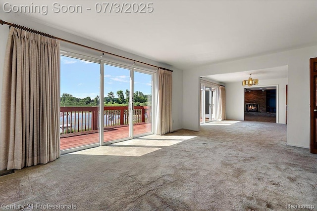 291 N Baldwin Rd, Clarkston, MI 48348 - unfurnished living room with carpet flooring, a chandelier, and a water view