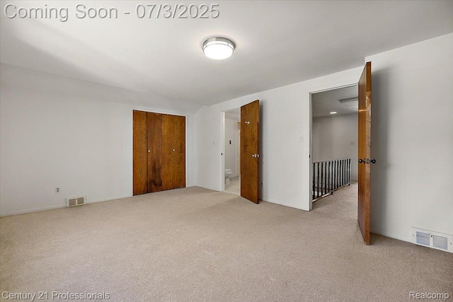 291 N Baldwin Rd, Clarkston, MI 48348 - unfurnished bedroom featuring carpet floors, a closet, and ensuite bath