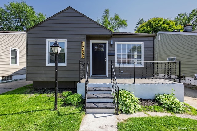 1730 E Hazelhurst St, Ferndale, MI 48220 - view of front of house with a front lawn