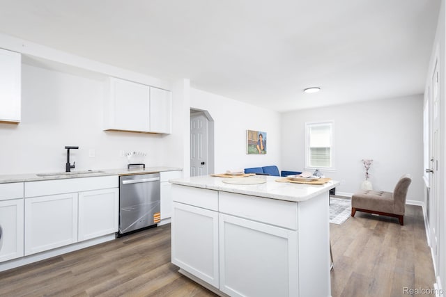 1730 E Hazelhurst St, Ferndale, MI 48220 - kitchen with stainless steel dishwasher, light wood-type flooring, and white cabinetry
