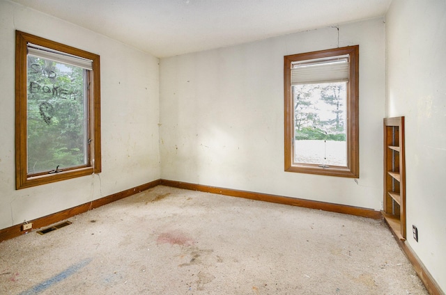 9563 Oak Rd, Willis, MI 48191 - spare room with light colored carpet and baseboards