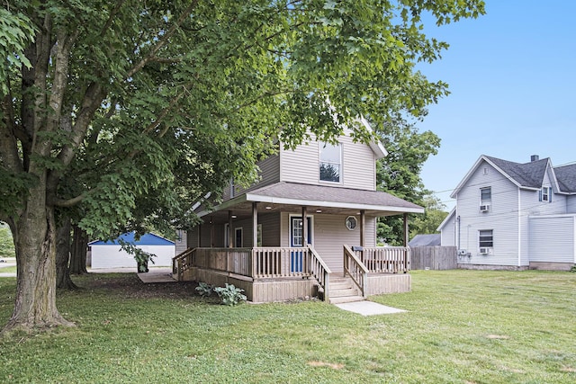 1003 Masonic Ave, Belding, MI 48809 - view of front of property featuring a porch and a front lawn