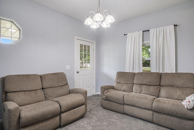 1003 Masonic Ave, Belding, MI 48809 - living area featuring carpet flooring, a chandelier, and plenty of natural light