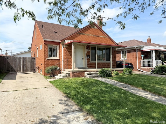 8121 Marian St, Warren, MI 48093 - bungalow featuring brick siding, a chimney, covered porch, driveway, and a shingled roof