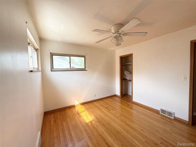 8121 Marian St, Warren, MI 48093 - unfurnished bedroom featuring light wood-type flooring, a closet, and ceiling fan