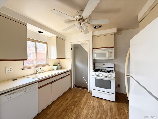 8121 Marian St, Warren, MI 48093 - kitchen featuring white appliances, light wood-style flooring, ceiling fan, and light countertops