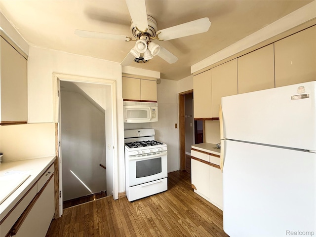 8121 Marian St, Warren, MI 48093 - kitchen with white appliances, wood finished floors, a ceiling fan, and light countertops