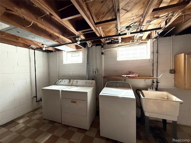 8121 Marian St, Warren, MI 48093 - washroom with dark flooring and separate washer and dryer
