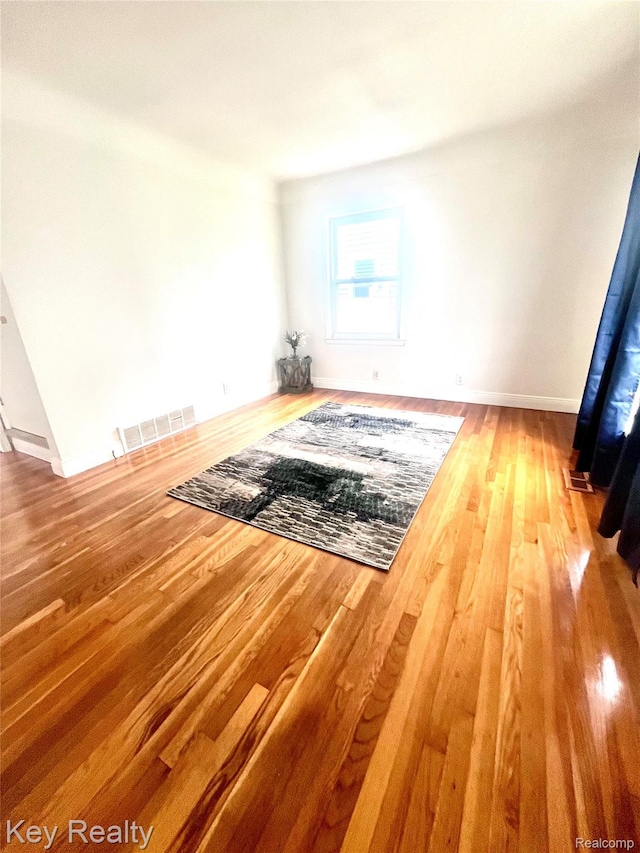 13509 Backus St, Southgate, MI 48195 - empty room featuring wood finished floors and baseboards