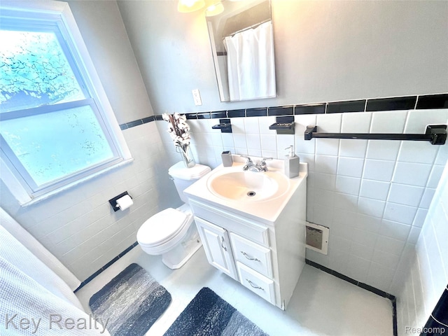 13509 Backus St, Southgate, MI 48195 - bathroom with vanity, tile walls, and a wainscoted wall