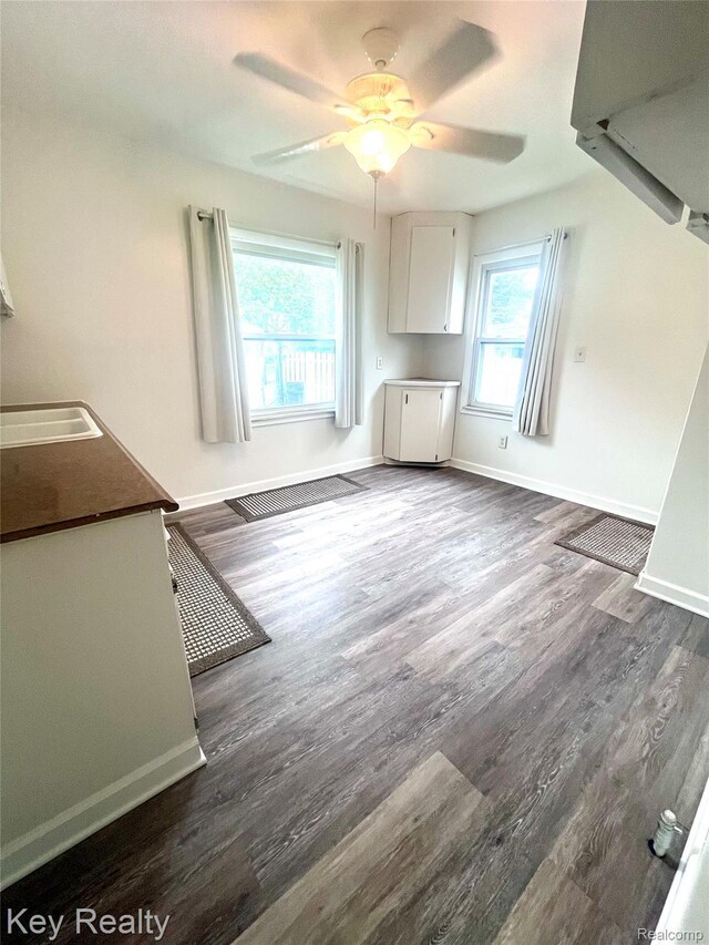 13509 Backus St, Southgate, MI 48195 - unfurnished dining area with dark wood-style floors and ceiling fan