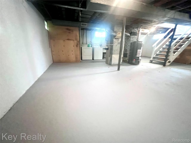 13509 Backus St, Southgate, MI 48195 - below grade area featuring washer and clothes dryer, water heater, stairway, and heating unit