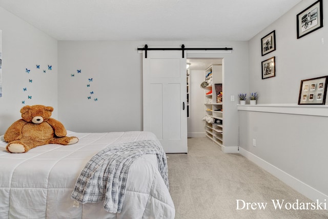 8205 Autumn Acres Dr, Rockford, MI 49341 - carpeted bedroom with a barn door and baseboards