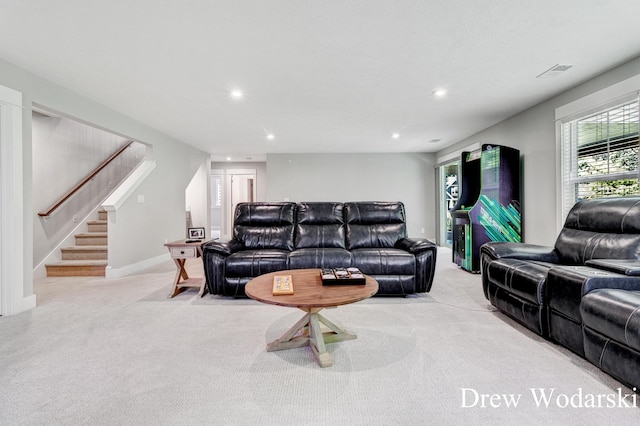 8205 Autumn Acres Dr, Rockford, MI 49341 - living room with light colored carpet, stairs, and recessed lighting