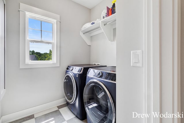 8205 Autumn Acres Dr, Rockford, MI 49341 - laundry area with washer and dryer and tile patterned floors