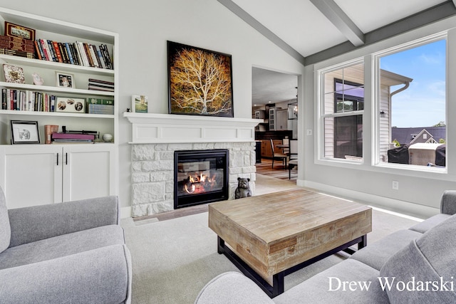 8205 Autumn Acres Dr, Rockford, MI 49341 - carpeted living room with a stone fireplace and baseboards
