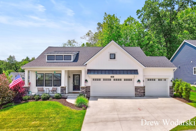 8205 Autumn Acres Dr, Rockford, MI 49341 - view of front of property featuring a porch, an attached garage, driveway, board and batten siding, and a shingled roof