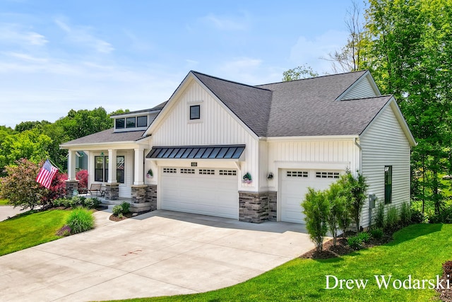 8205 Autumn Acres Dr, Rockford, MI 49341 - view of front facade with roof with shingles, an attached garage, a porch, and concrete driveway