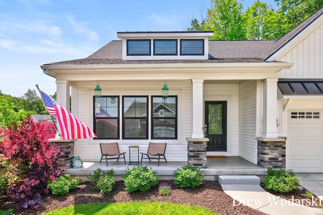 8205 Autumn Acres Dr, Rockford, MI 49341 - view of front of house with a porch, stone siding, a shingled roof, an attached garage, and board and batten siding