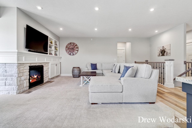 8205 Autumn Acres Dr, Rockford, MI 49341 - living room featuring recessed lighting and a fireplace
