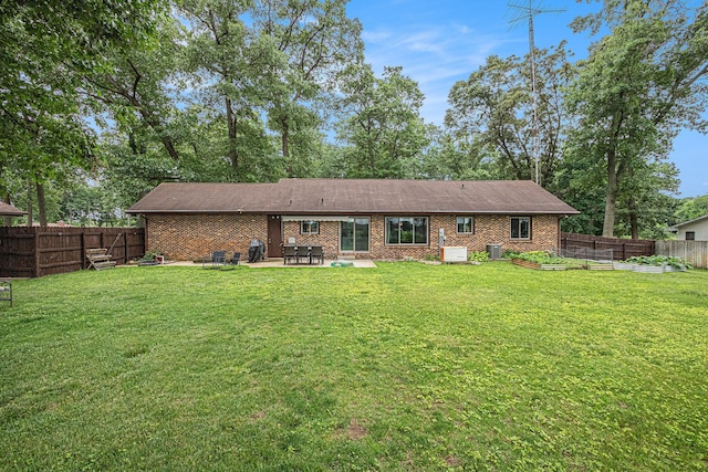 33370 Frantz Dr, Niles, MI 49120 - back of house featuring a patio, a fenced backyard, a garden, and brick siding