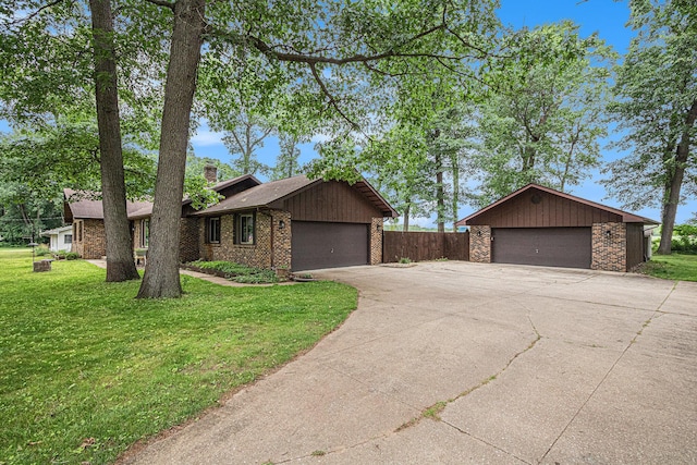 33370 Frantz Dr, Niles, MI 49120 - view of front of property with brick siding, a chimney, and a garage