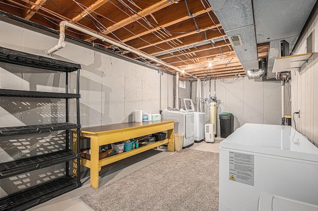 33370 Frantz Dr, Niles, MI 49120 - unfinished basement featuring separate washer and dryer and refrigerator