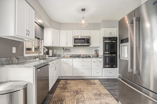 33370 Frantz Dr, Niles, MI 49120 - kitchen featuring stainless steel appliances, white cabinetry, light stone counters, and dark wood-style floors