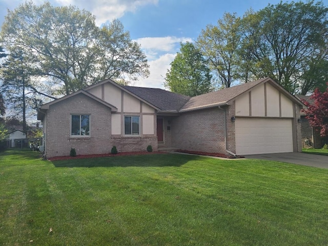 3393 Kevin Cir, Warren, MI 48092 - tudor home with a garage, brick siding, driveway, and a front lawn