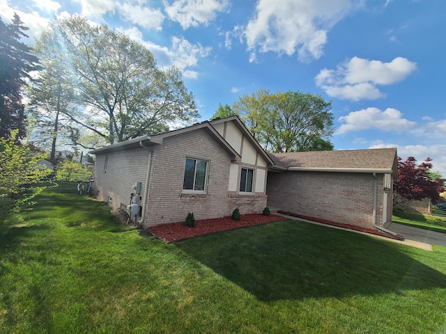 3393 Kevin Cir, Warren, MI 48092 - view of side of property featuring brick siding and a lawn